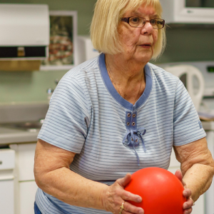 senior woman holding ball